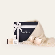 Luxe Cadeau Evening Hour gift box in navy packaging with a white mohair throw.
