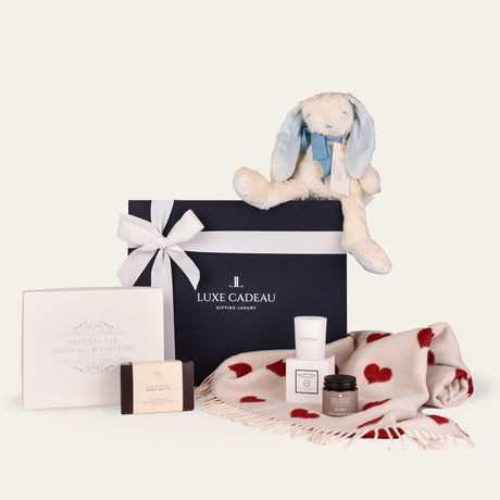 Luxe Cadeau The First Embrace gift box in navy packaging.
